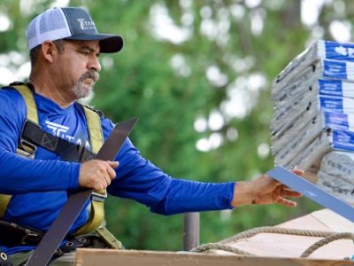 Titan employee installing roof